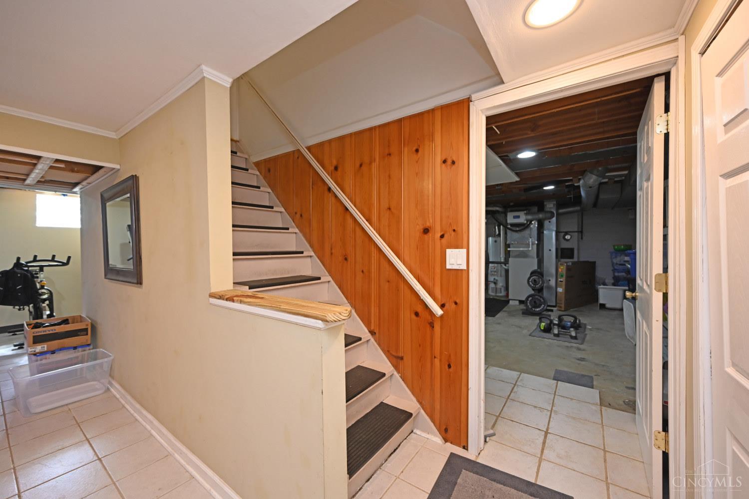 8851 Roundhill Road Cincinnati, OH 45236 - Photo 22 of 34 Stairs down to the basement.