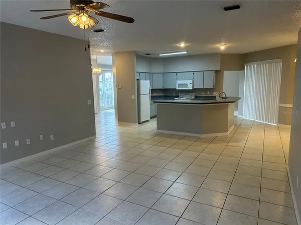 a kitchen with stainless steel appliances a sink and cabinets