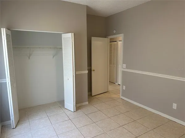 an empty room with a bench