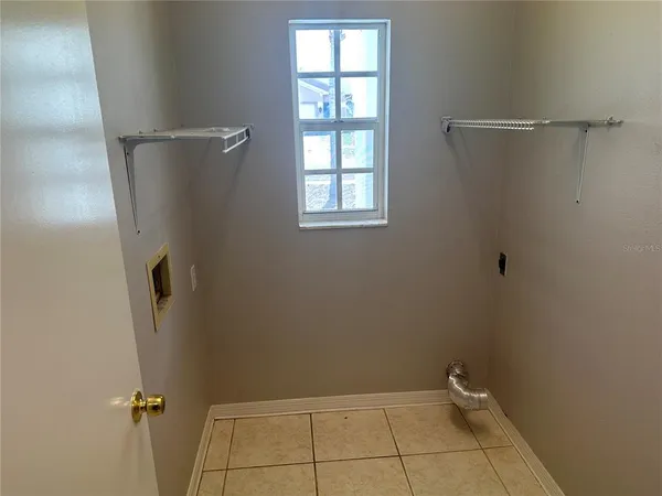 an outdoor view of house with backyard