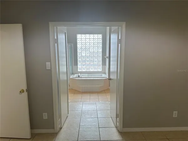 a view of an empty room with a window