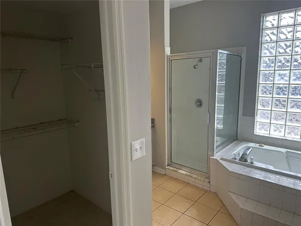 a bathroom with a bathtub and shower