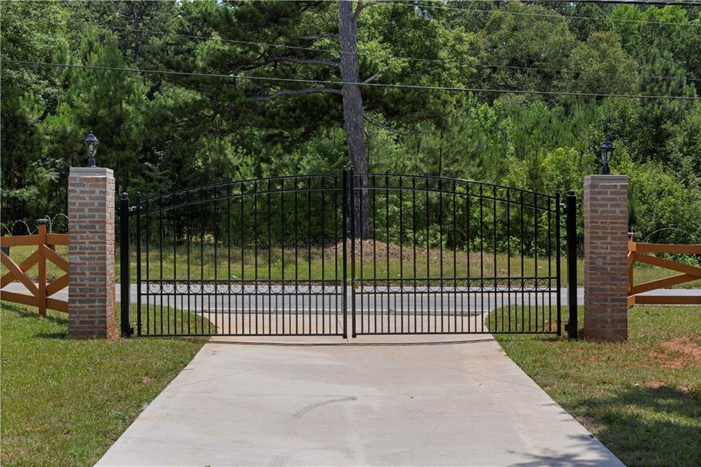 5245 Stonewall Tell Road Atlanta, GA 30349 - Photo 15 of 15 a view of a park with iron fence