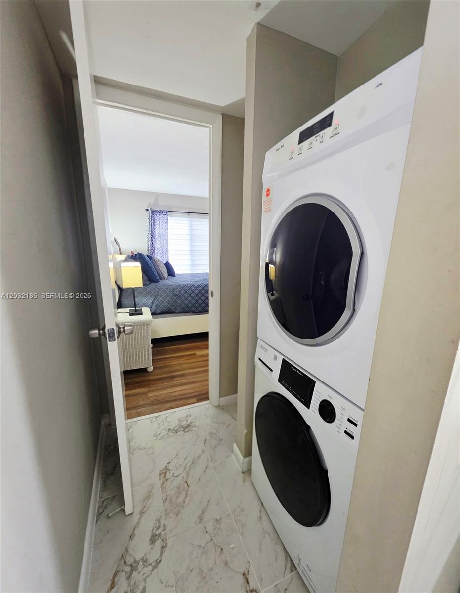 4164 Inverrary Drive, Unit 204 Lauderhill, FL 33319 - Photo 18 of 28 a utility room with dryer and washer
