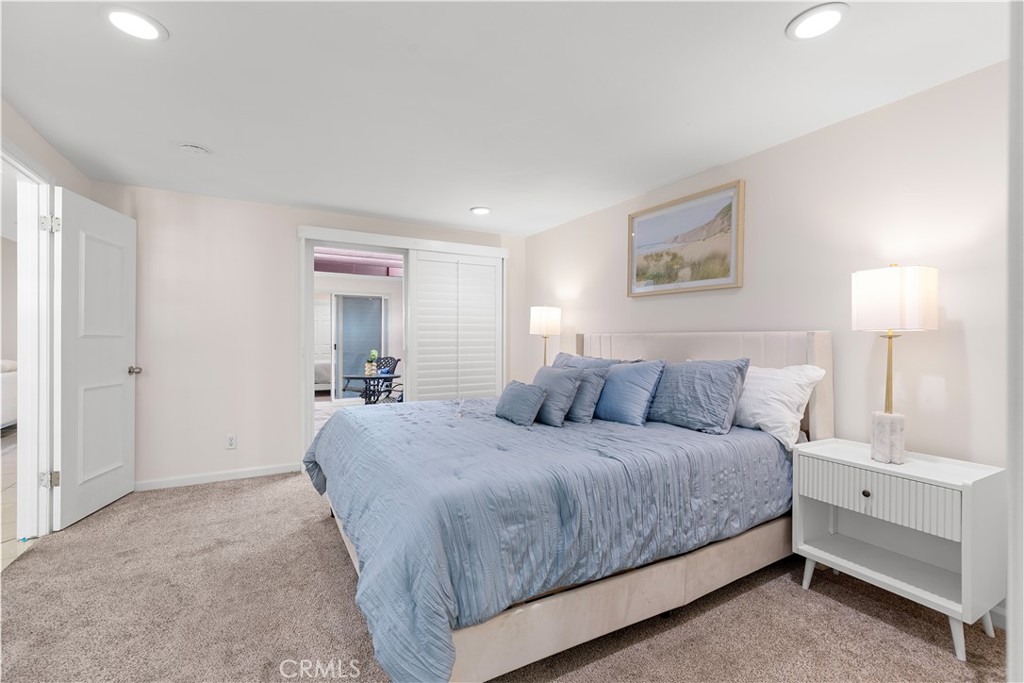 14332 Kipling Lane Tustin, CA 92780 - Photo 6 of 16 a bedroom with a bed and a lamp