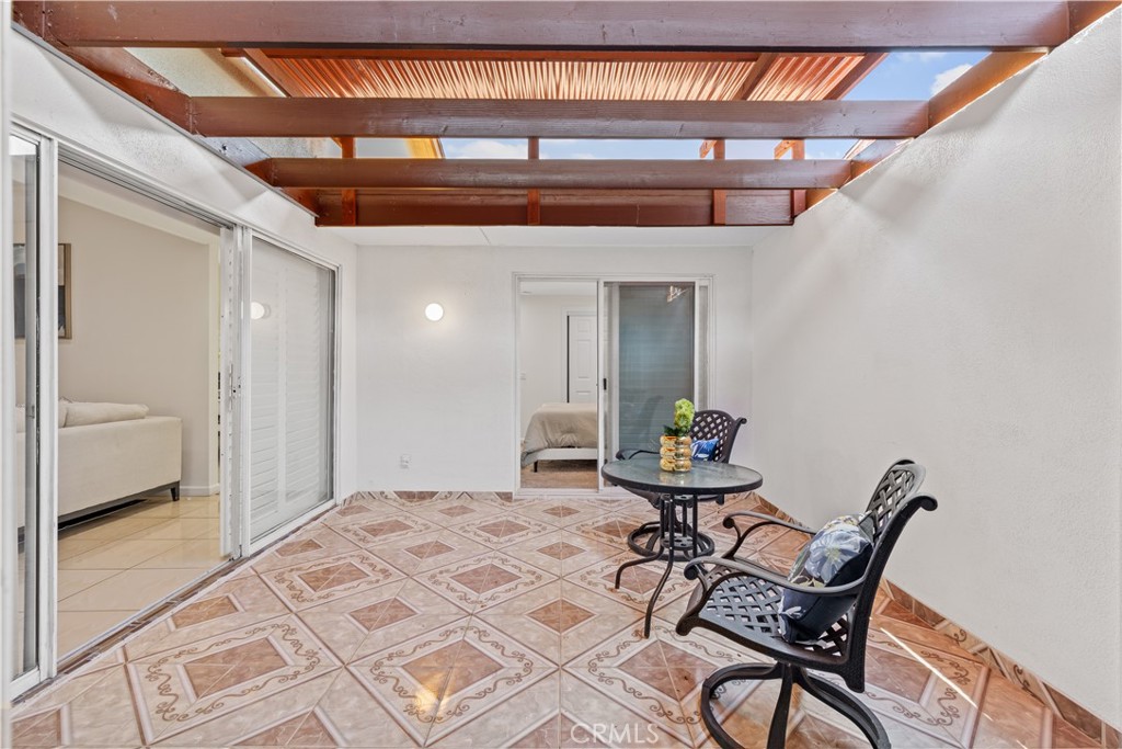 14332 Kipling Lane Tustin, CA 92780 - Photo 7 of 16 a workspace room with furniture and wooden floor