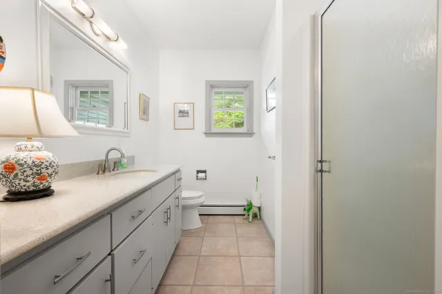 a bathroom with a sink and a window
