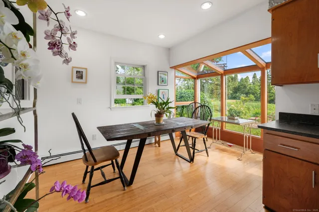 a view of a dining room with furniture window and outside view