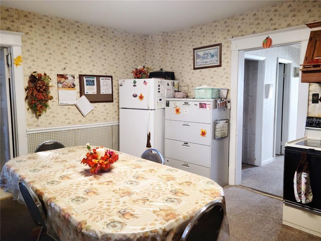 521 West Main Street Rural Valley, PA 16249 - Photo 3 of 14 a bedroom with a bed and a table