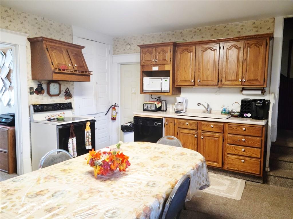 521 West Main Street Rural Valley, PA 16249 - Photo 4 of 14 a kitchen with stainless steel appliances a sink stove and cabinets