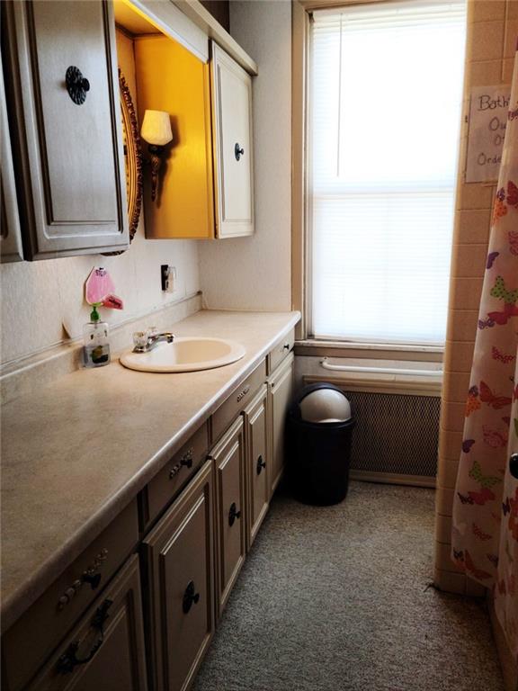 521 West Main Street Rural Valley, PA 16249 - Photo 7 of 14 a bathroom with a sink a toilet and a mirror