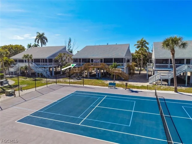 a view of a house with backyard porch and sitting area
