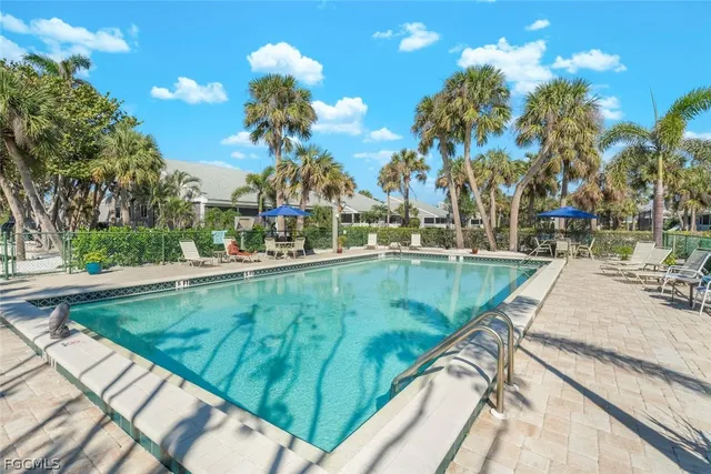 an aerial view of a house with a lot of trees all around