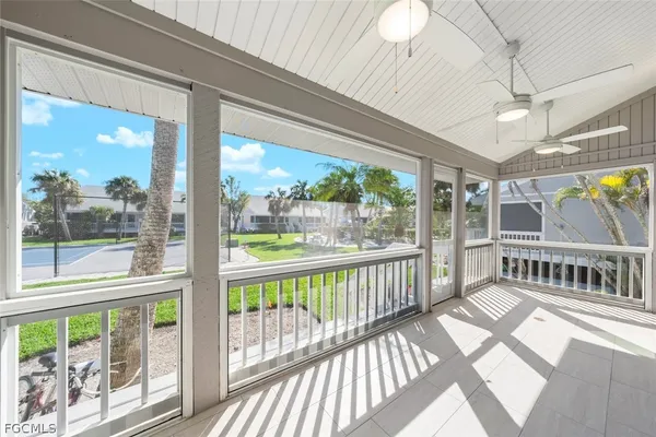 a view of a porch with wooden floor