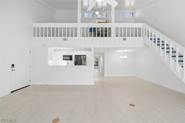 a view of staircase with white walls