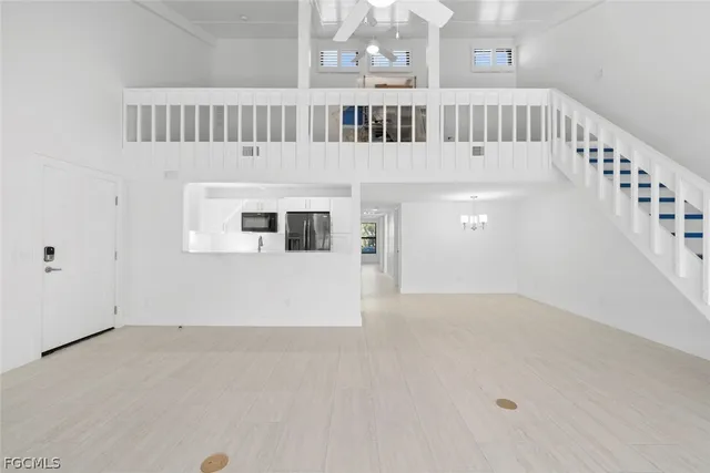 a view of staircase with white walls