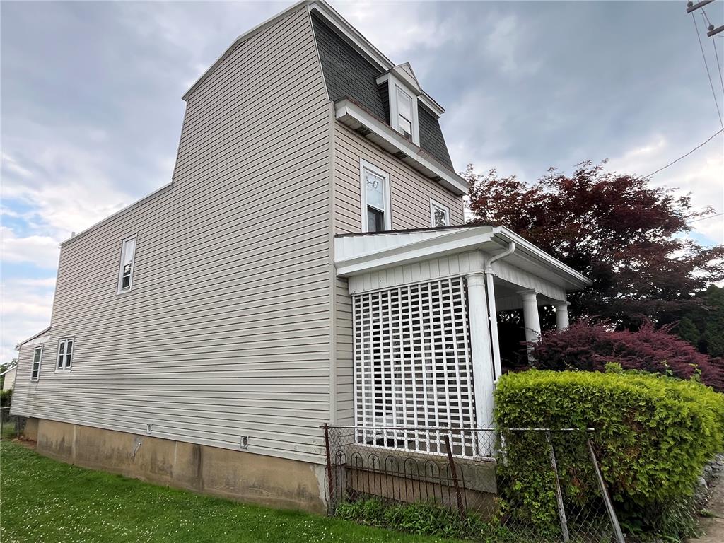 765 3rd Street Whitehall, PA 18052 - Photo 2 of 30 A charming porch with classic columns and privacy lattice defines this inviting home's exterior.