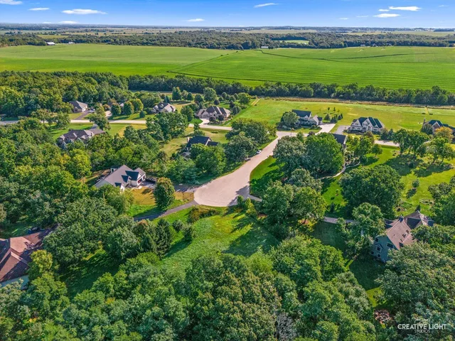 an aerial view of multiple house with a yard