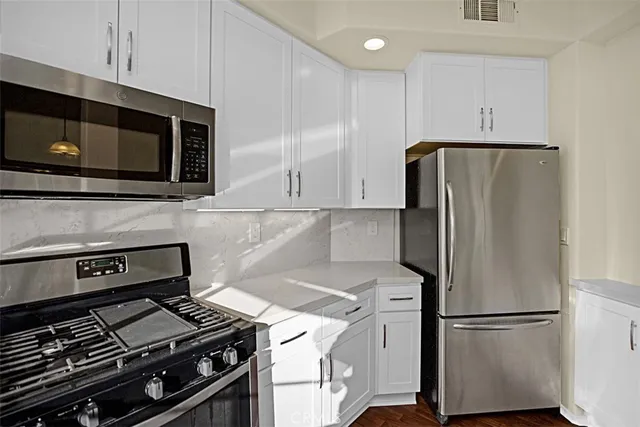 a kitchen with a stove and a microwave