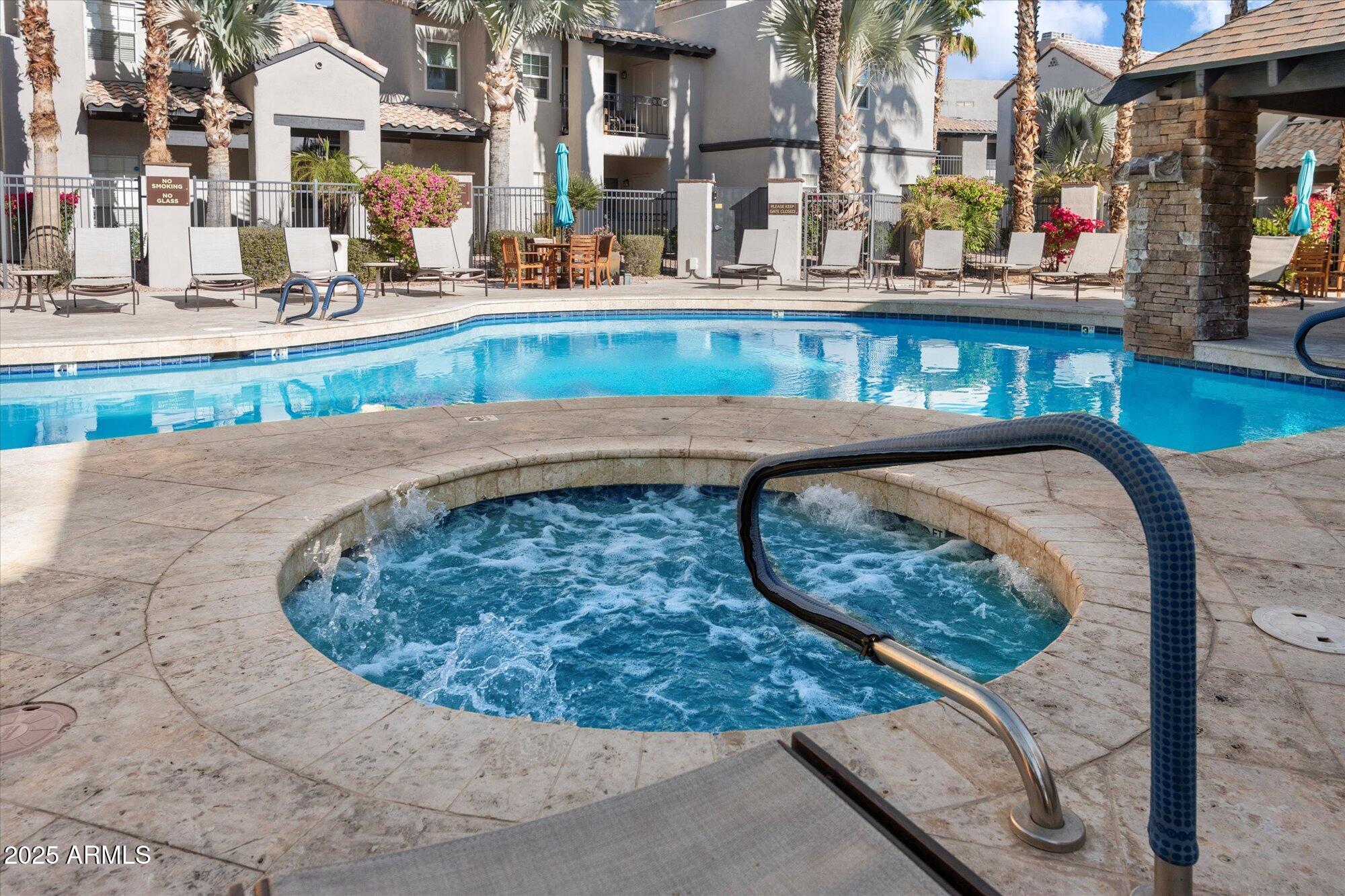 14145 North 92nd Street, Unit 2141 Scottsdale, AZ 85260 - Photo 36 of 38 Heated spa at pool
