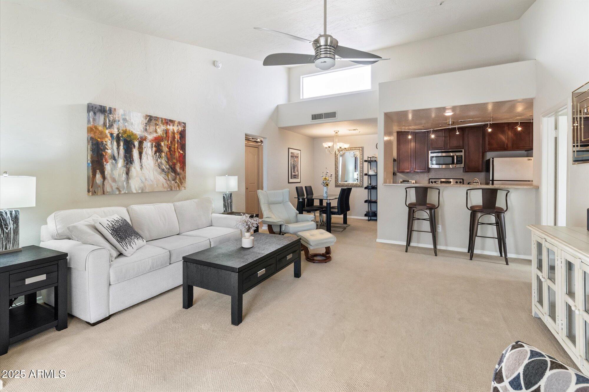 14145 North 92nd Street, Unit 2141 Scottsdale, AZ 85260 - Photo 6 of 38 Living room, kitchen, dining rooms