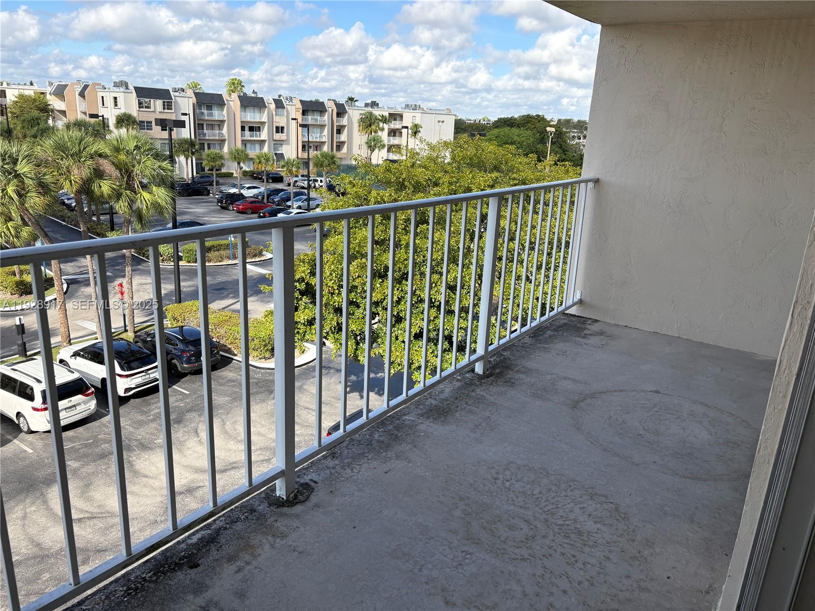 7747 Southwest 86th Street, Unit D411 Miami, FL 33143 - Photo 11 of 17 a view of a balcony with city view