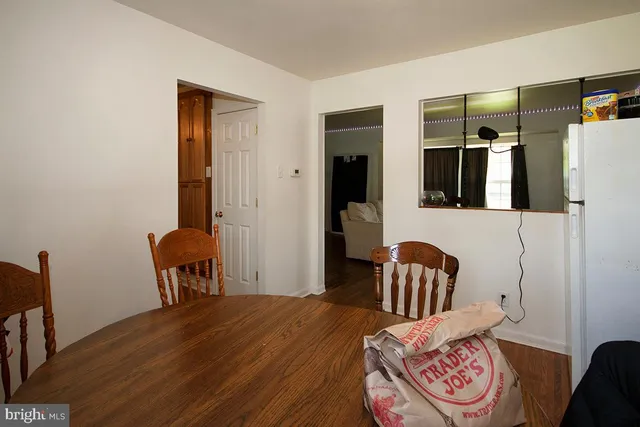 a bedroom with furniture and wooden floor
