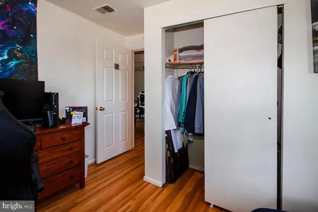 a view of hallway with wooden floor