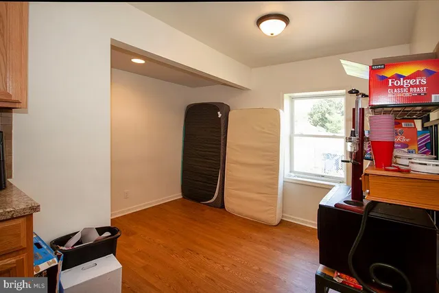 a view of room with window and flat screen tv
