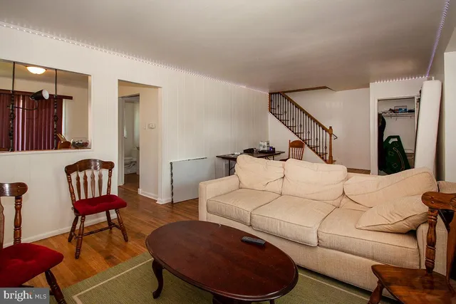 a living room with furniture and a painting