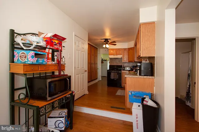 a kitchen view with stainless steel appliances a stove and a refrigerator