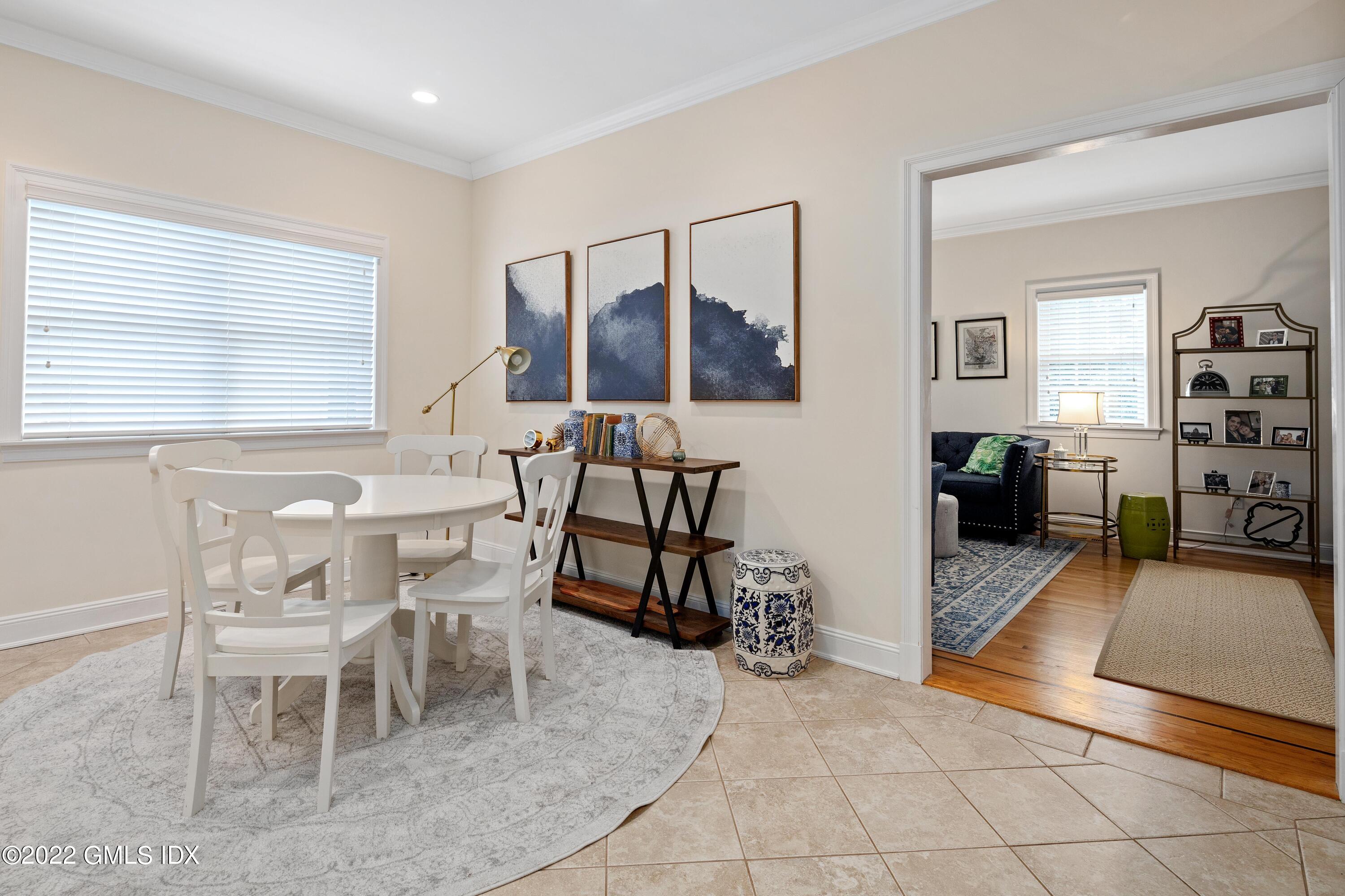 34 Windy Knolls, Unit B Greenwich, CT 06831 - Photo 11 of 37 a view of a livingroom with furniture and a window