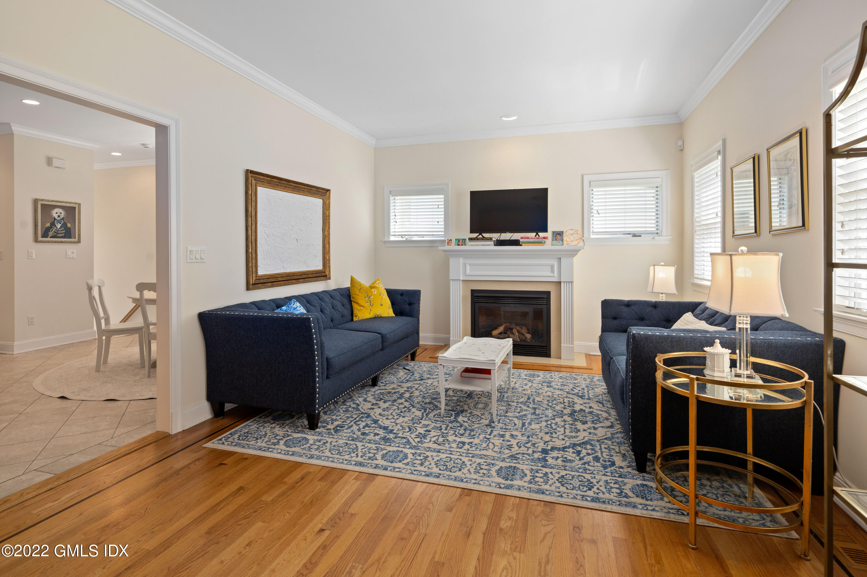 34 Windy Knolls, Unit B Greenwich, CT 06831 - Photo 16 of 37 a living room with furniture a flat screen tv and a fireplace