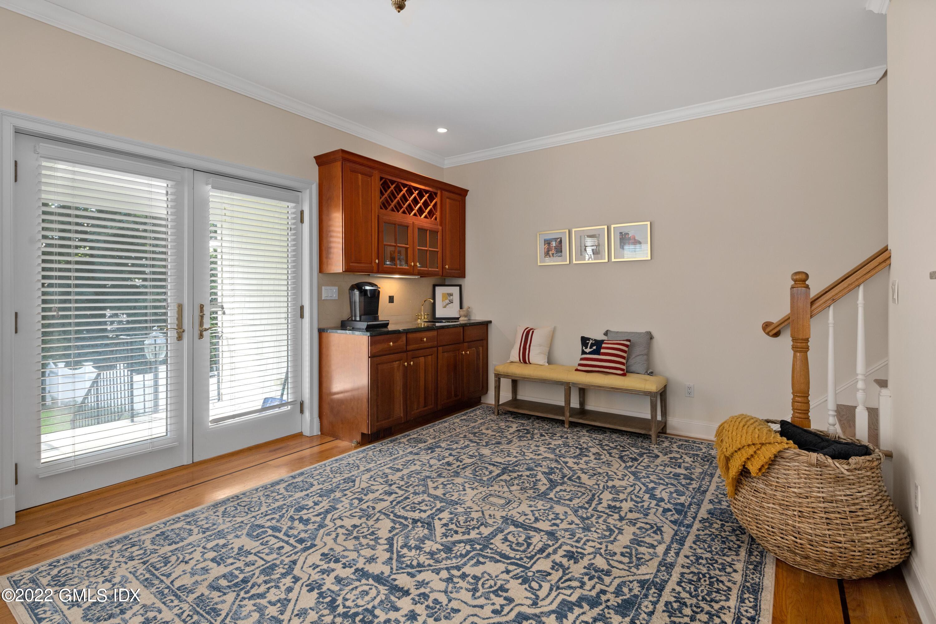 34 Windy Knolls, Unit B Greenwich, CT 06831 - Photo 20 of 37 a living room with furniture and a rug