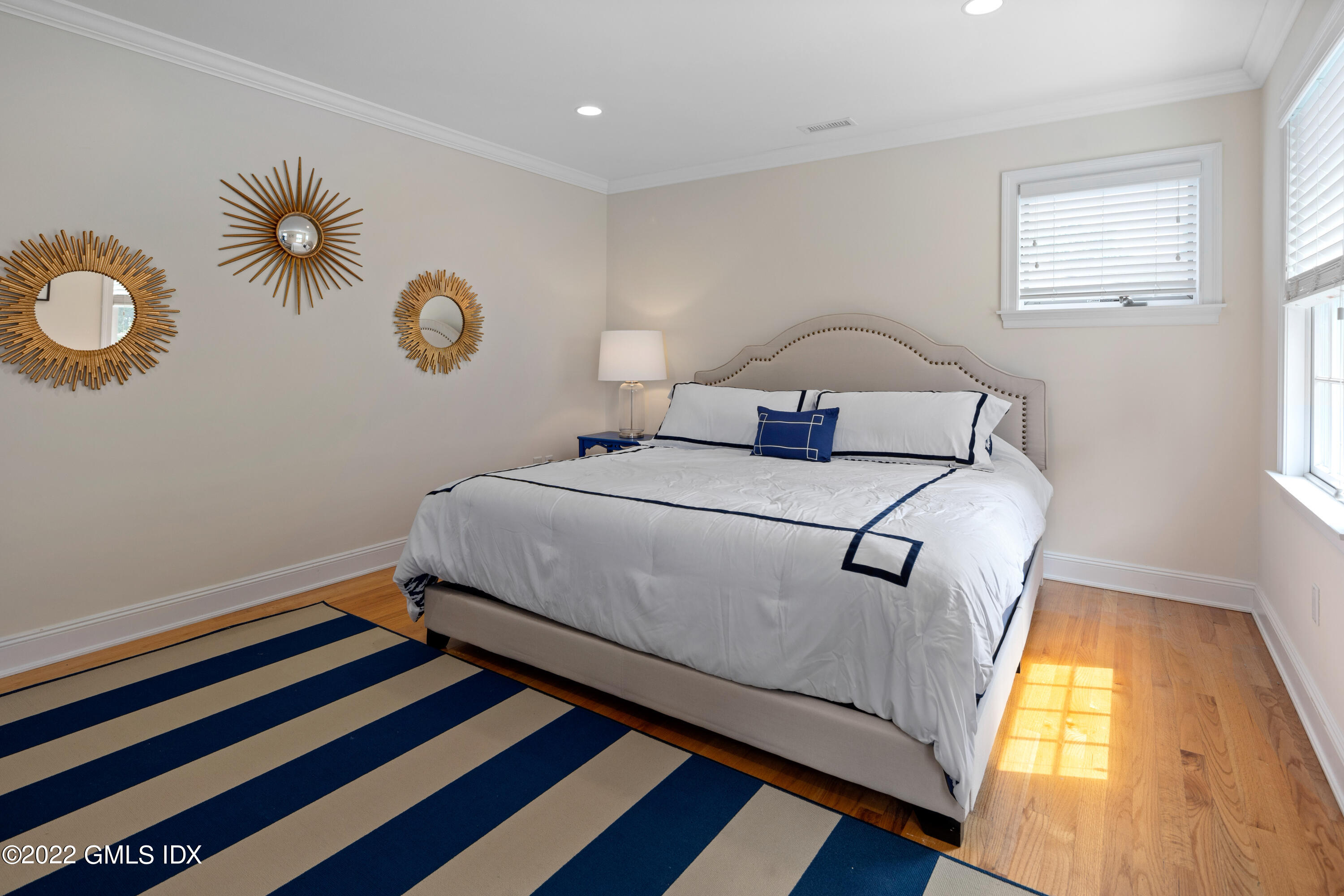 34 Windy Knolls, Unit B Greenwich, CT 06831 - Photo 25 of 37 a bedroom with a bed and a window