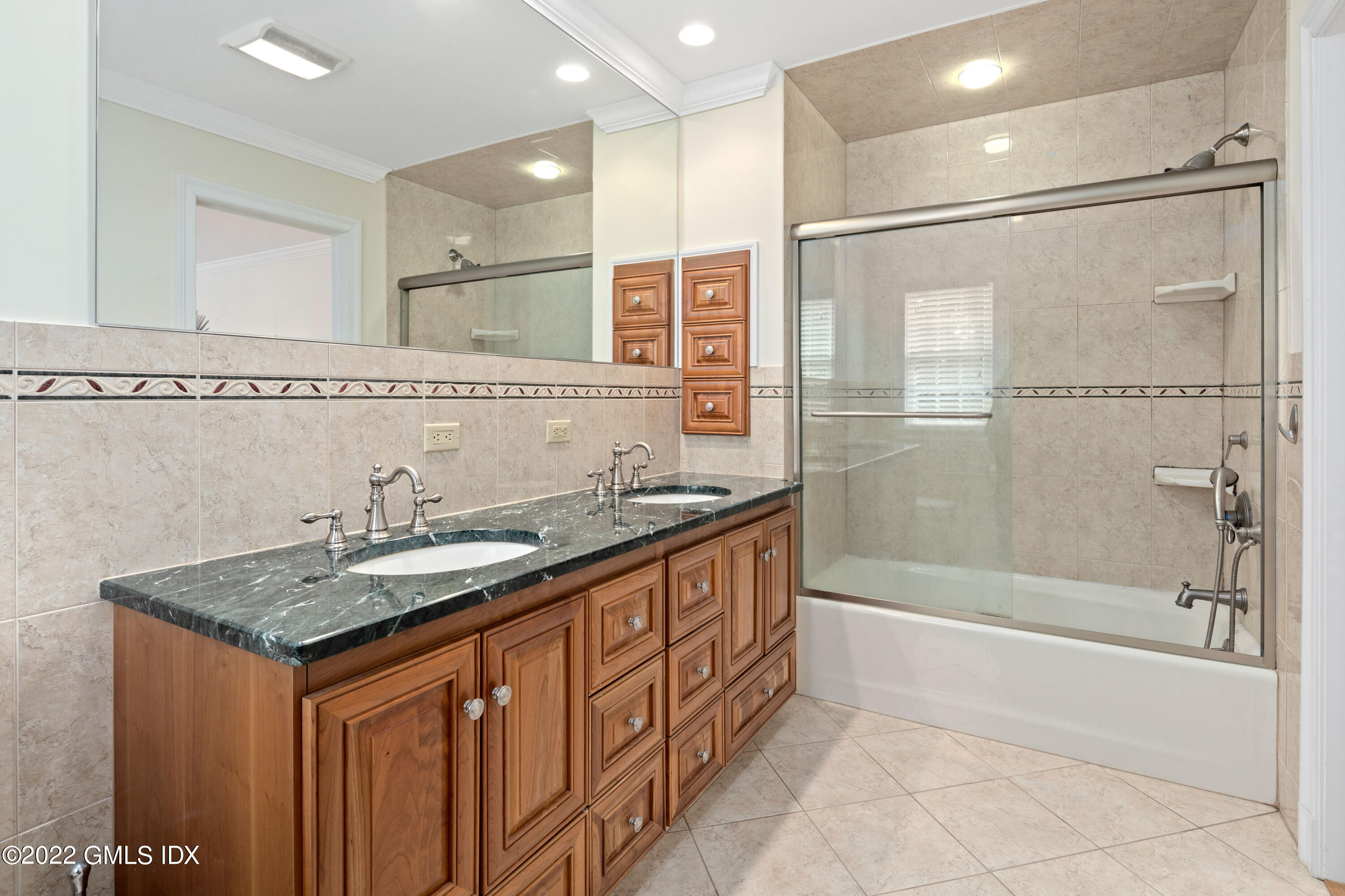34 Windy Knolls, Unit B Greenwich, CT 06831 - Photo 28 of 37 a bathroom with a granite countertop sink mirror and a bathtub