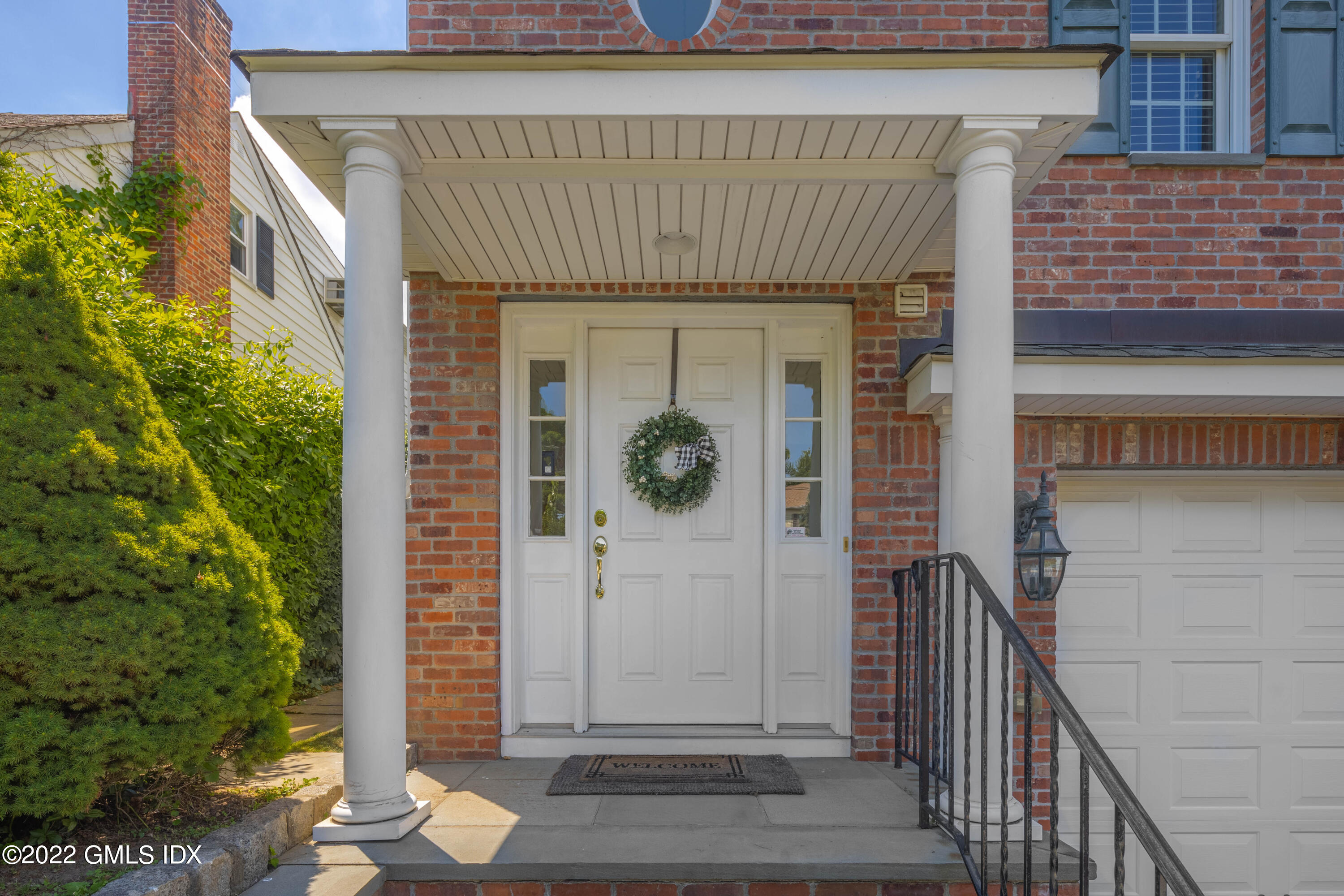 34 Windy Knolls, Unit B Greenwich, CT 06831 - Photo 3 of 37 a front view of a house with entryway