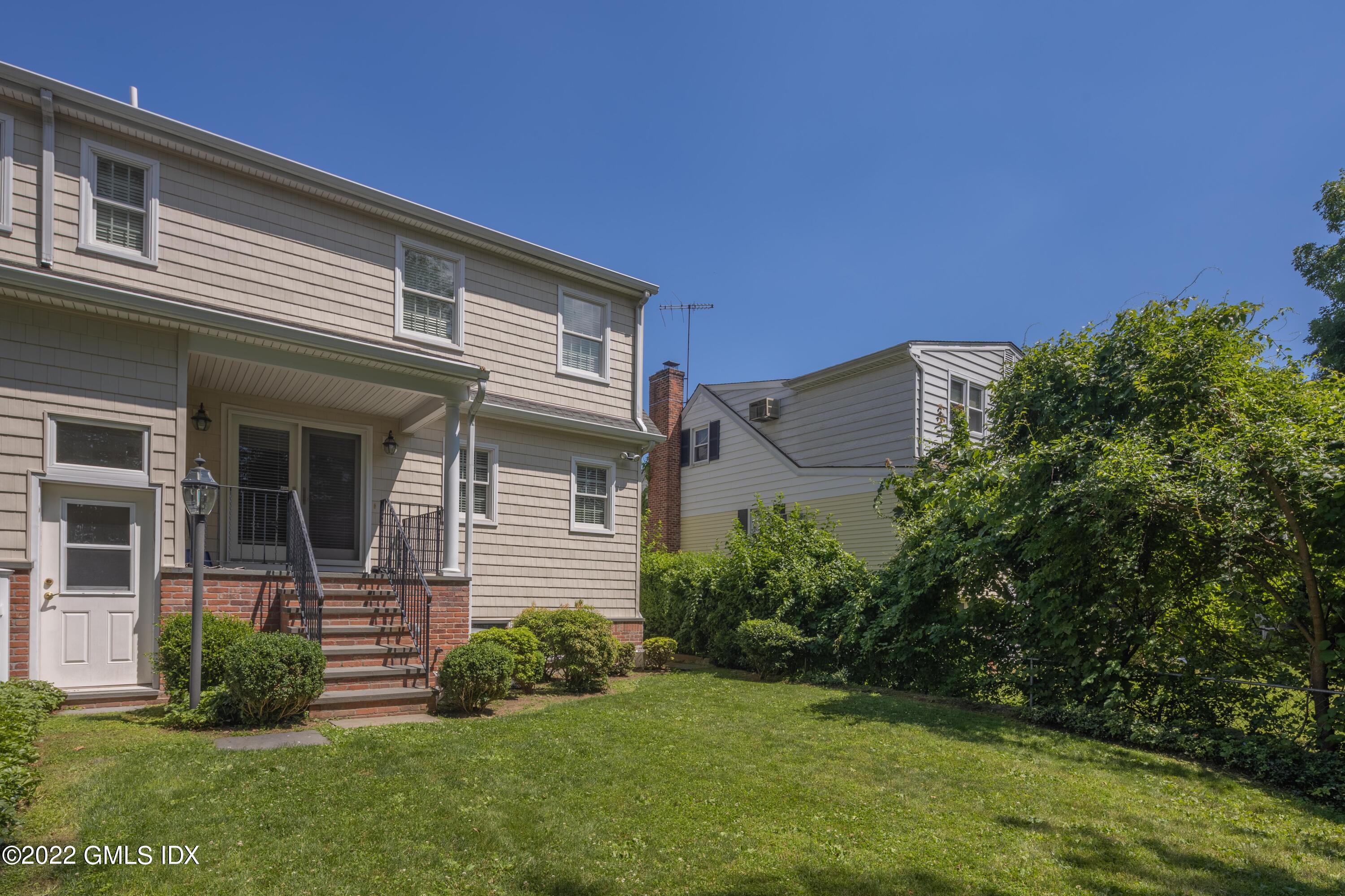 34 Windy Knolls, Unit B Greenwich, CT 06831 - Photo 34 of 37 a view of a house with a yard
