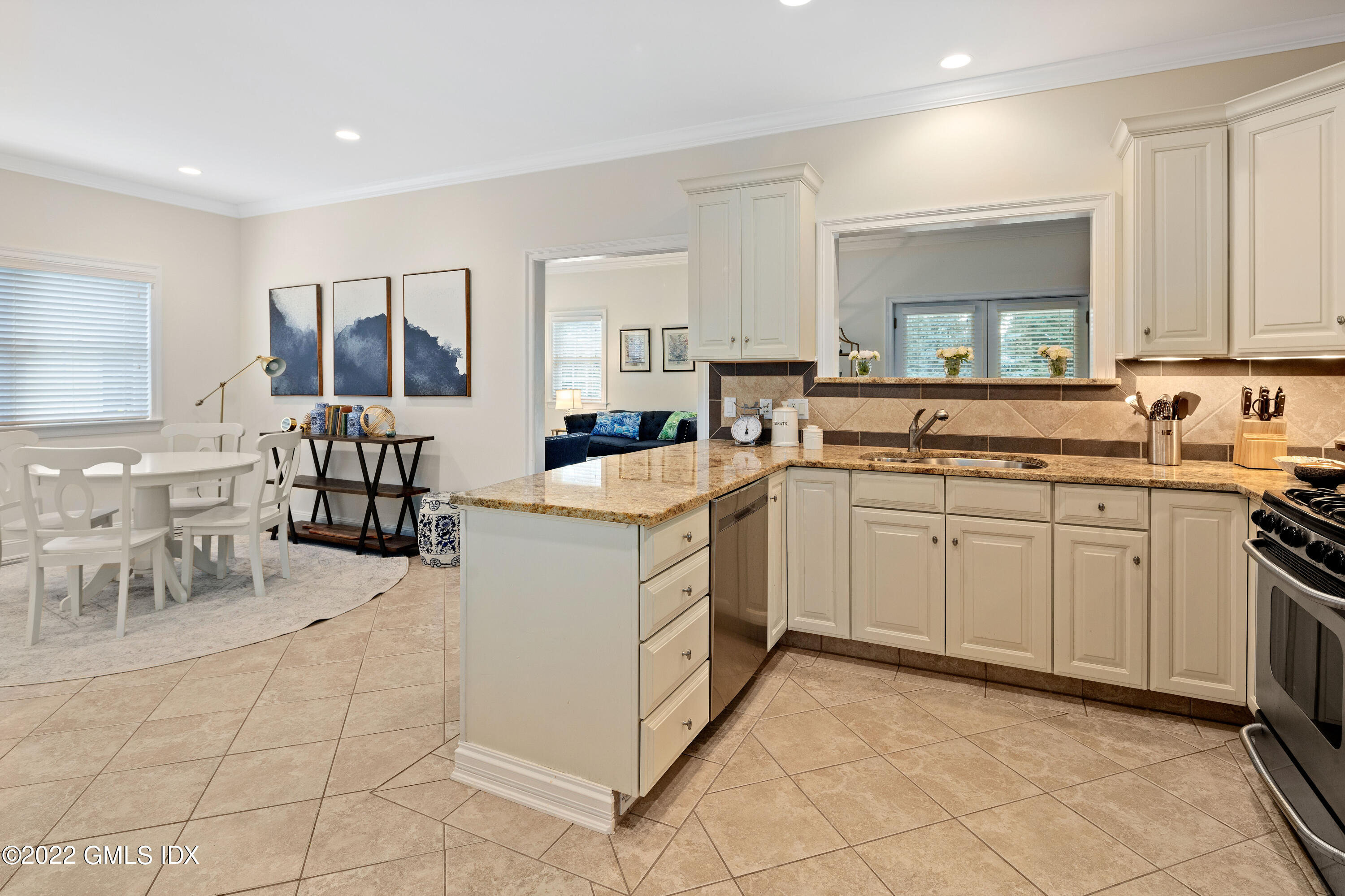 34 Windy Knolls, Unit B Greenwich, CT 06831 - Photo 5 of 37 a kitchen with cabinets and chairs