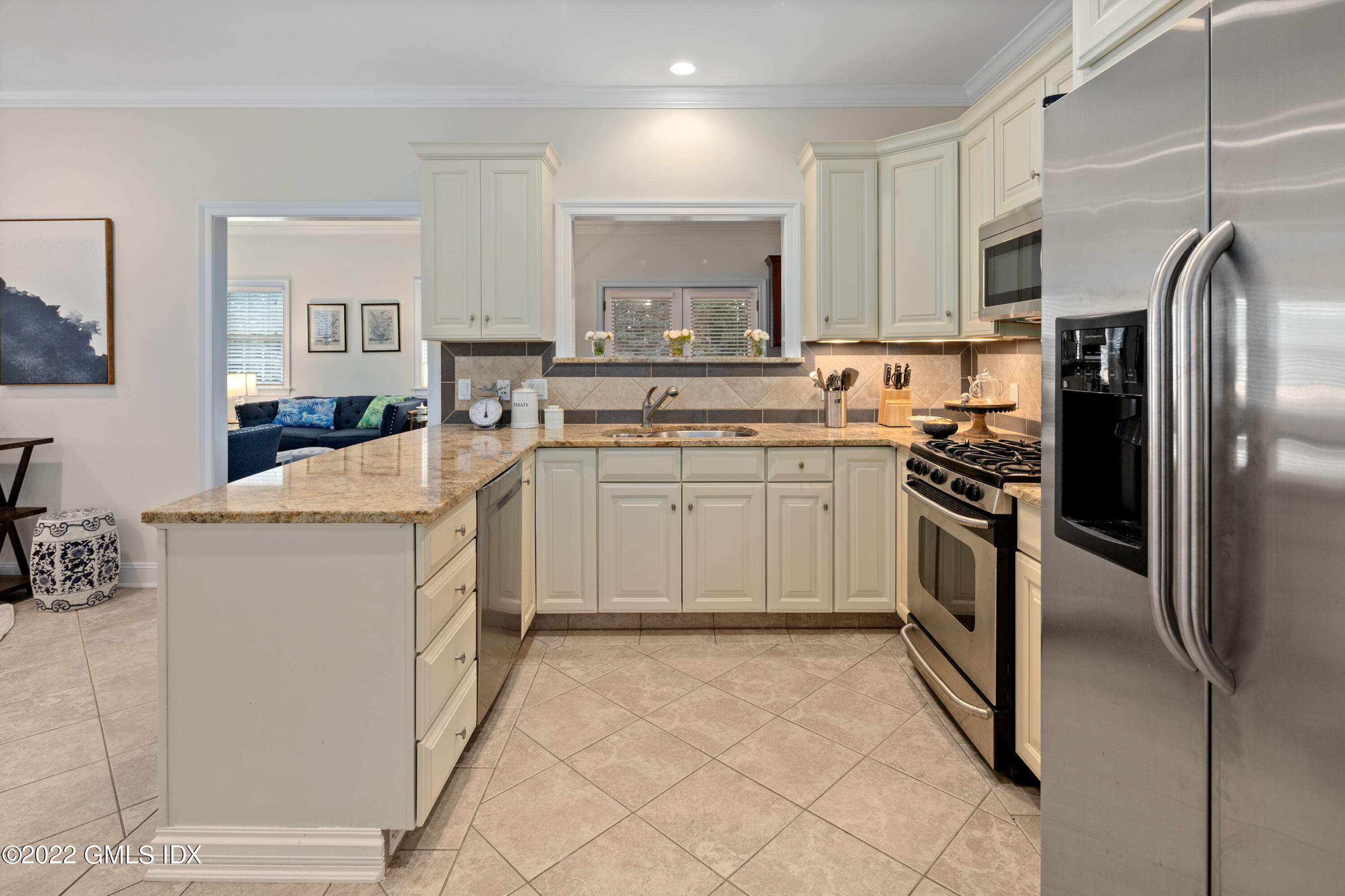 34 Windy Knolls, Unit B Greenwich, CT 06831 - Photo 7 of 37 a kitchen with a sink appliances and cabinets