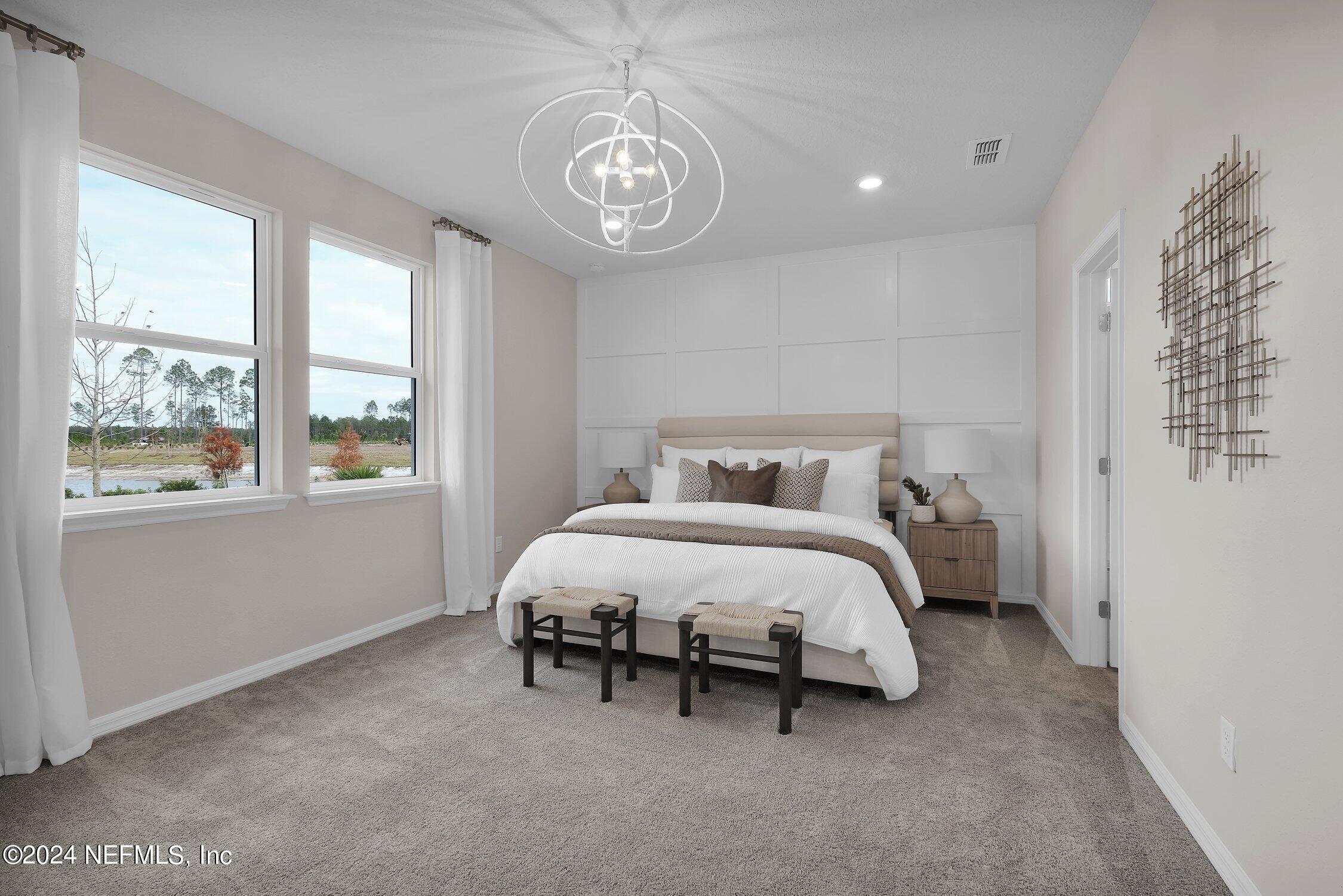 330 Salt Meadow Loop Yulee, FL 32097 - Photo 10 of 20 a spacious bedroom with a bed and a window