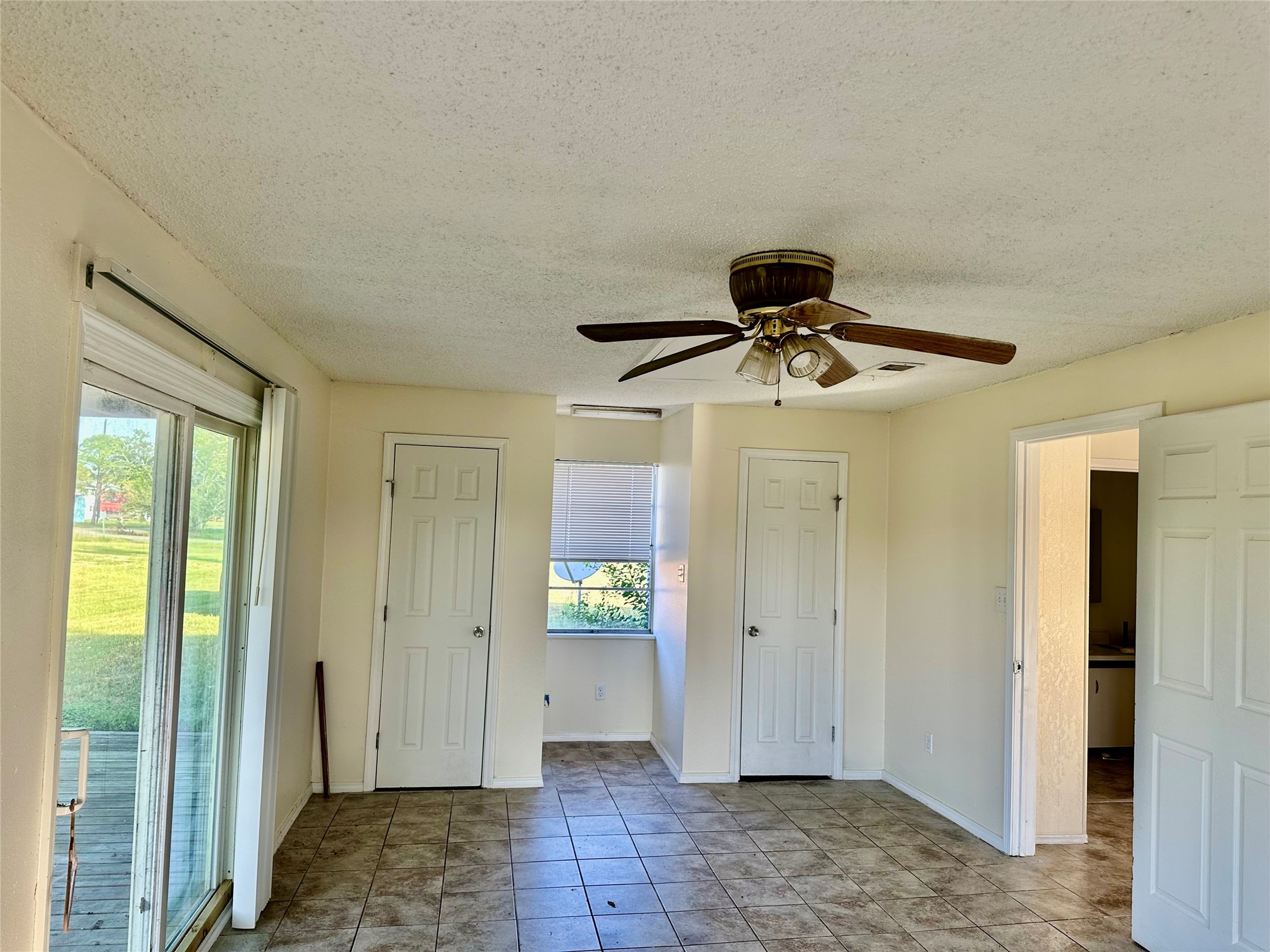 1414 Angle Road Angleton, TX 77515 - Photo 12 of 24 a view of a hallway with a chandelier fan and windows