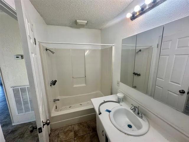 a view of an empty room with glass door