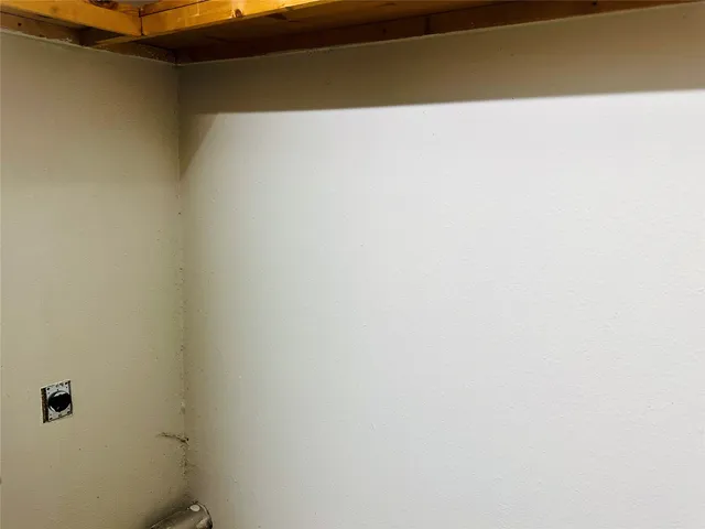 a bathroom with a shower and a sink