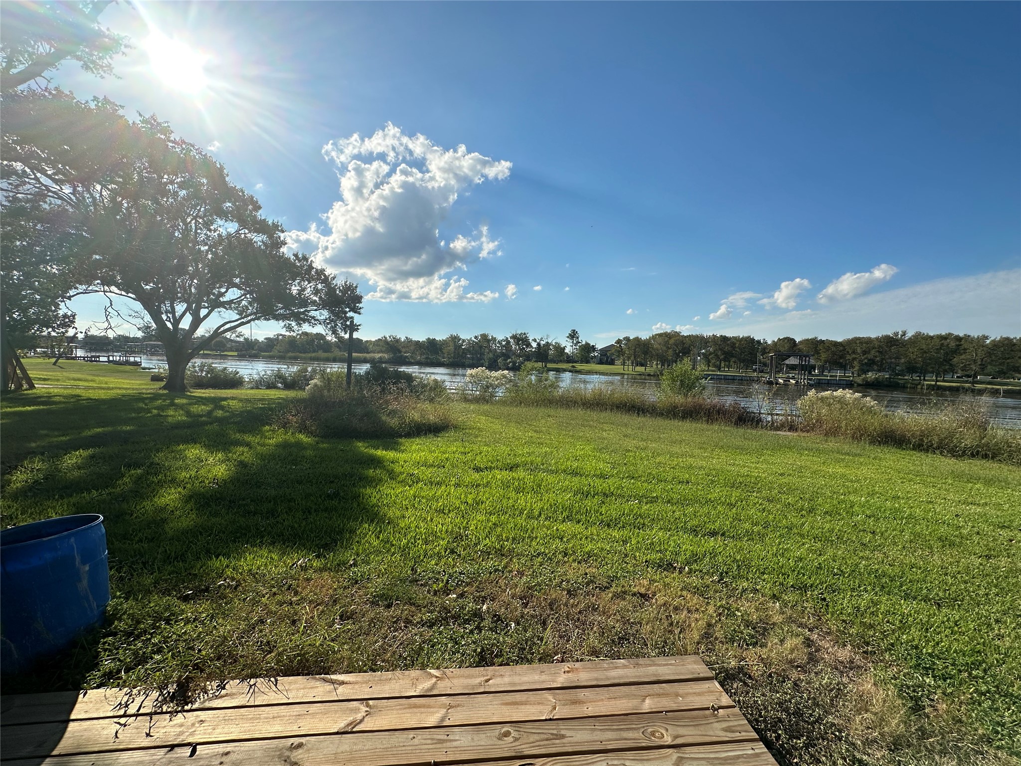 1414 Angle Road Angleton, TX 77515 - Photo 4 of 24 a view of a lake with a big yard
