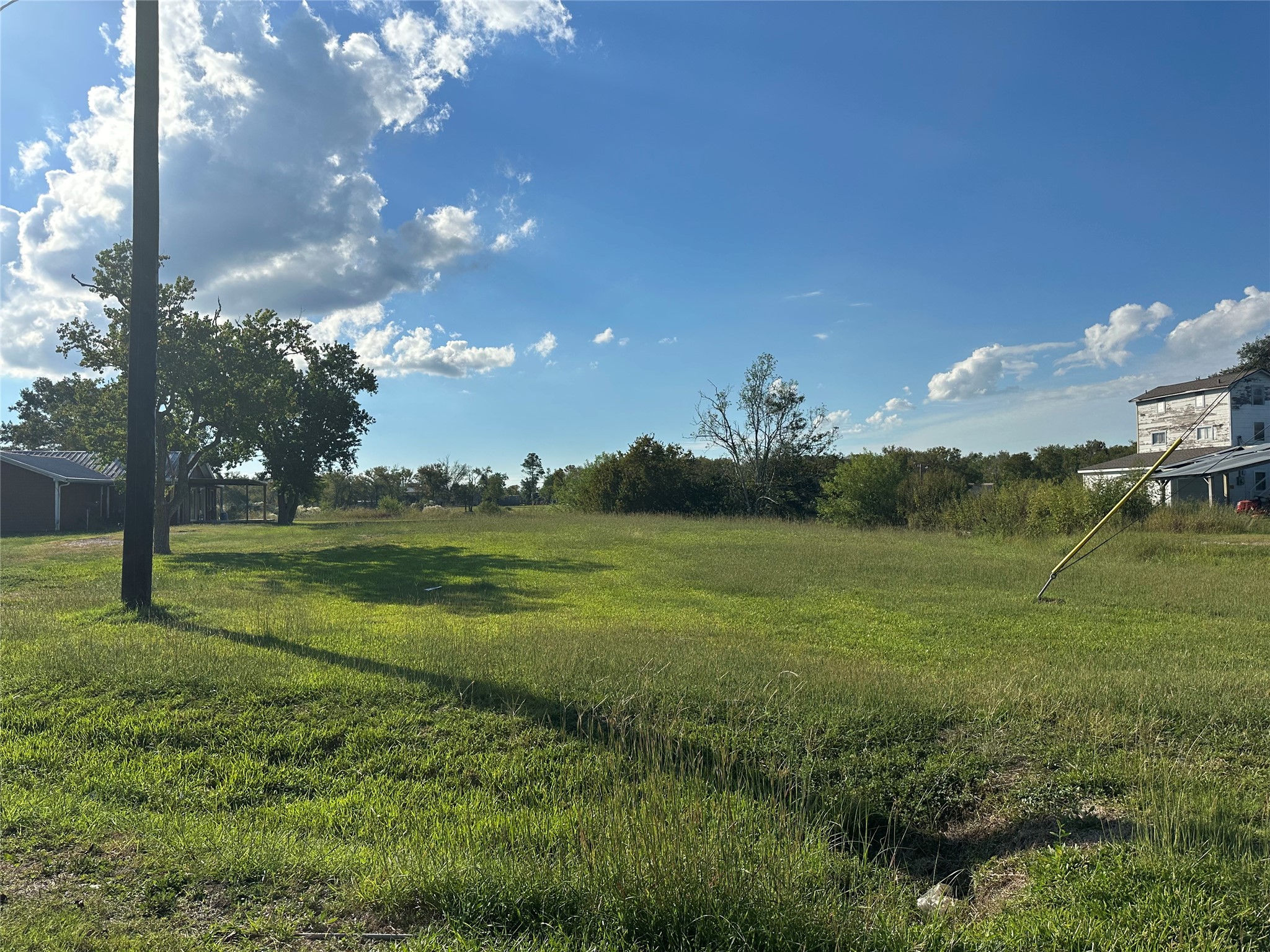 1414 Angle Road Angleton, TX 77515 - Photo 5 of 24 a view of a golf course with a lake