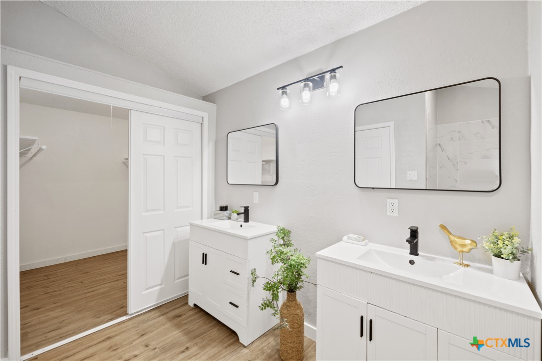 804 Antelope Trail Temple, TX 76504 - Photo 18 of 32 a bathroom with a double vanity sink mirror and