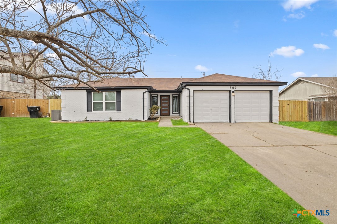 804 Antelope Trail Temple, TX 76504 - Photo 2 of 32 a front view of a house with a garden and yard