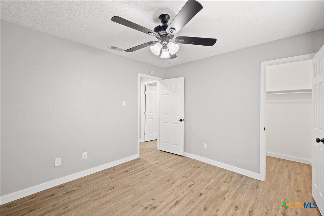 804 Antelope Trail Temple, TX 76504 - Photo 24 of 32 wooden floor in an empty room with a window