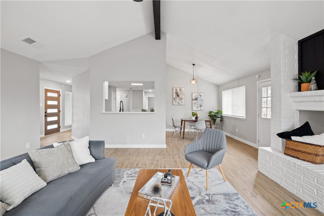 804 Antelope Trail Temple, TX 76504 - Photo 9 of 32 a living room with furniture and a wooden floor